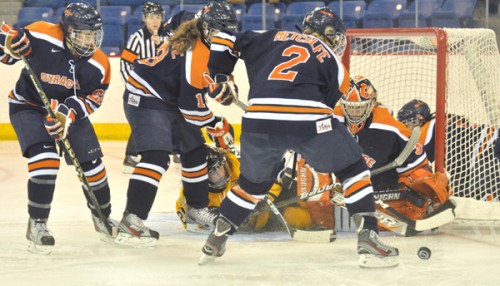 <h3>Syracuse 3, Quinnipiac 2</h3>Quinnipiac's Brittany Lyons is surrounded by several Orange players in the second period of Saturday's game.