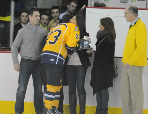 Quinnipiac 4, Yale 1Quinnipiac captain Zack Currie hugs the Mascali family after Quinnipiac wins the Heroes Hat by beating Yale on Friday.