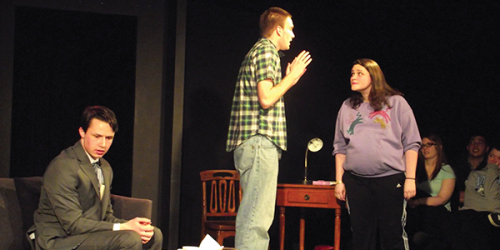 From left to right: Jacob Nadeau (Gabriel), Joe Skaleski (Michael), and Nicki Palmer (Mia) argue about the various possible fathers of her unborn child.