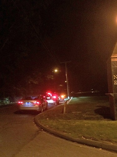 Uber cars line up outside of the New Road entrance to the Mount Carmel campus.