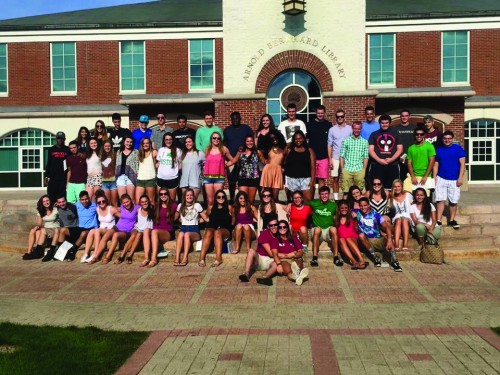Two orientation leaders with their merged freshmen groups during Welcome Weekend.