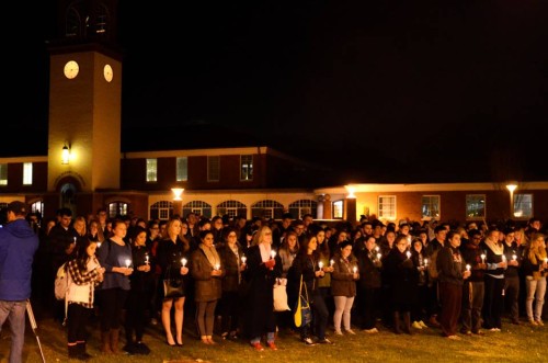 The QU community gathered on the Quad to show their support for Paris.