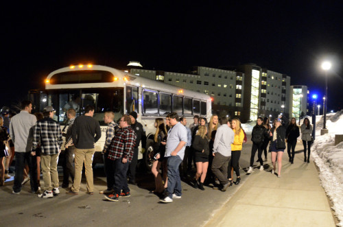 Students wait to board New Haven shuttle on the York Hill campus. 