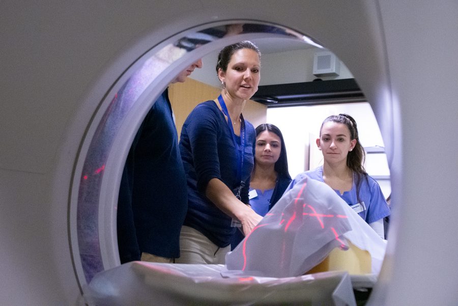  Quinnipiac radiologic sciences students imaging skeletal remains. Remains must be covered unless there is permission from familial descendants.