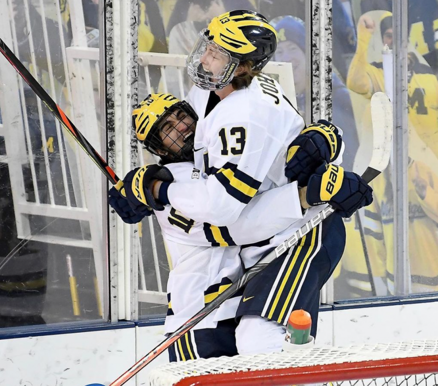 Matty Beniers celebrates with Kent Johnson