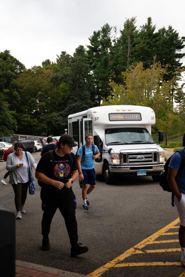 Students walk out of a shuttle that runs between Mount Carmel and York Hill campuses.