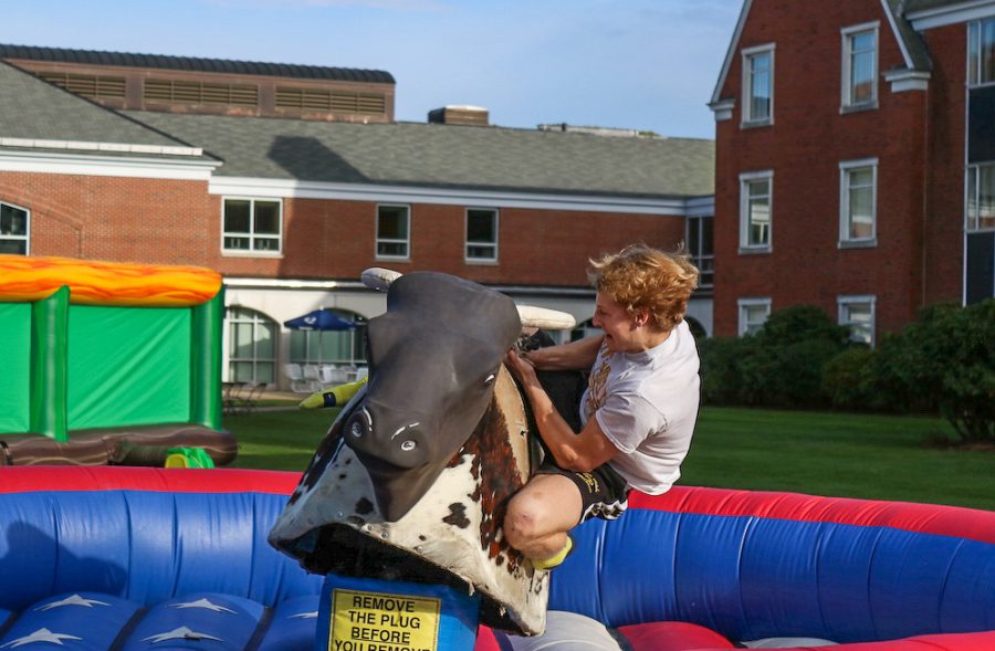 Andrew Menzel, a first-year film, television and media arts major, rides the mechanical bull.
