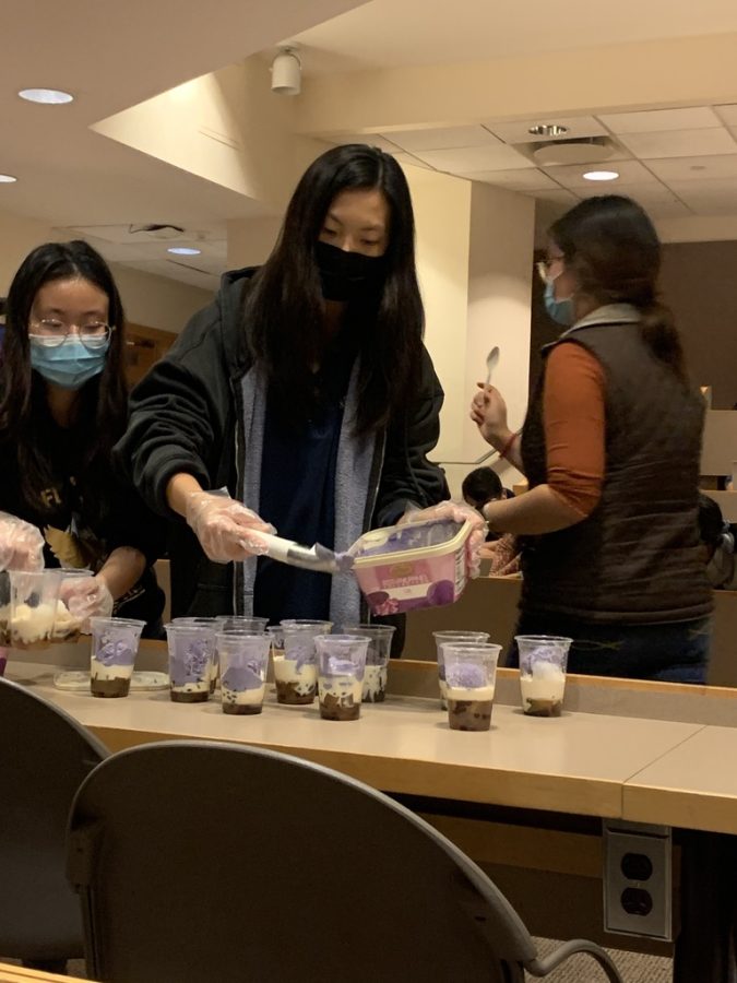 Asian Student Alliance members prepare halo-halo, a Filipino dessert made with jellied fruit, evaporated milk and other ingredients.