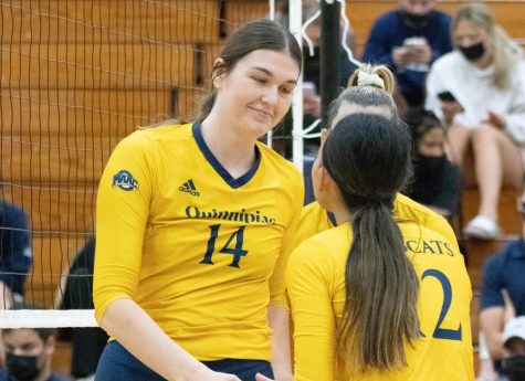 Senior middle blocker Nicole Legg (left) contributed two kills and a block assists in a crucial seven-point run during the second set in Quinnipiacs 3-1 win.