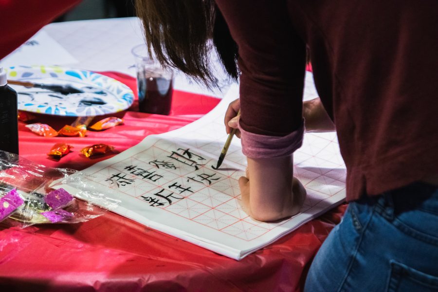 The Asian Student Alliance offered calligraphy and other activities in its Lunar New Year celebration. Photo by