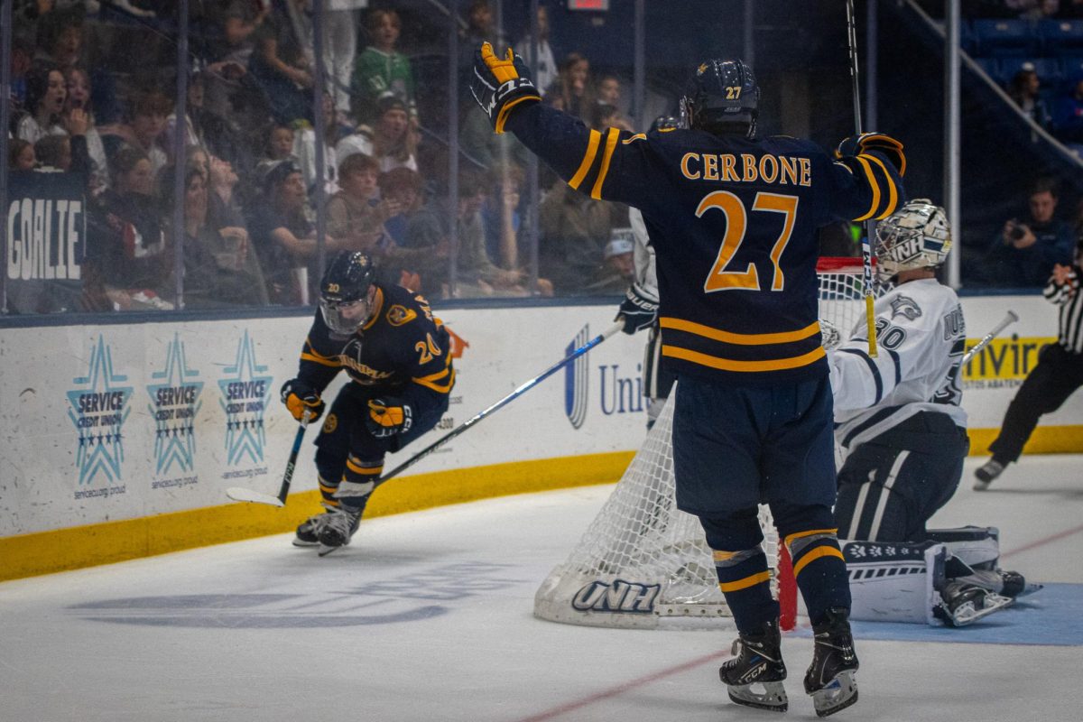 Quinnipiac sophomore forwards Mason Marcellus and Andon Cerbone celebrate after a go-ahead goal against New Hampshire on October 21, 2023. 