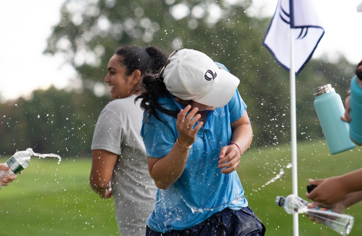 Quinnipiac graduate student Leeyen Peralta is doused in water by her teammates after winning the Quinnipiac Classic at the Farms Country Club in Wallingford, Connecticut on Oct. 10. 