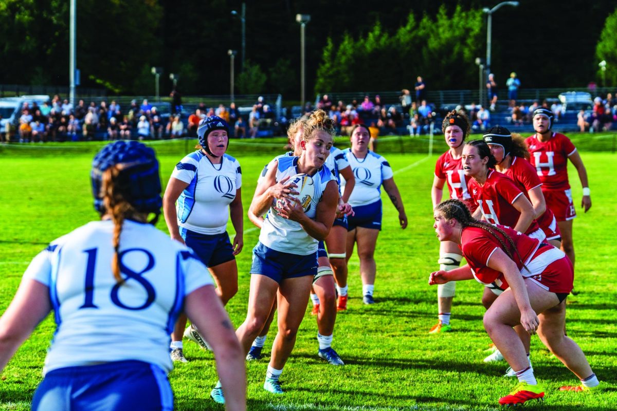 Quinnipiac graduate student forward Gracie Cartwright braces for a tackle during the Bobcat's home opener against Harvard on Sept. 2. 