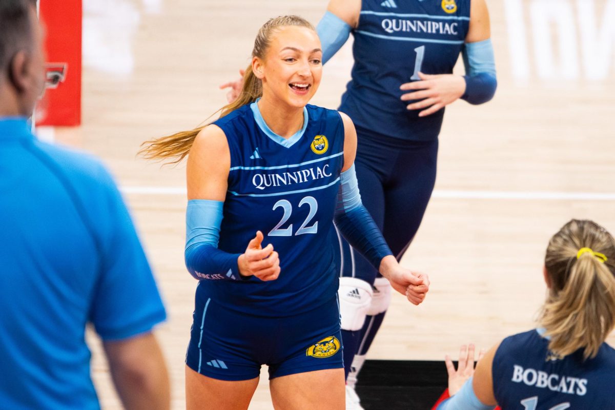 Quinnipiac middle blocker Lexi Morse celebrates during the team's MAAC semifinal victory over Iona on Nov. 19.