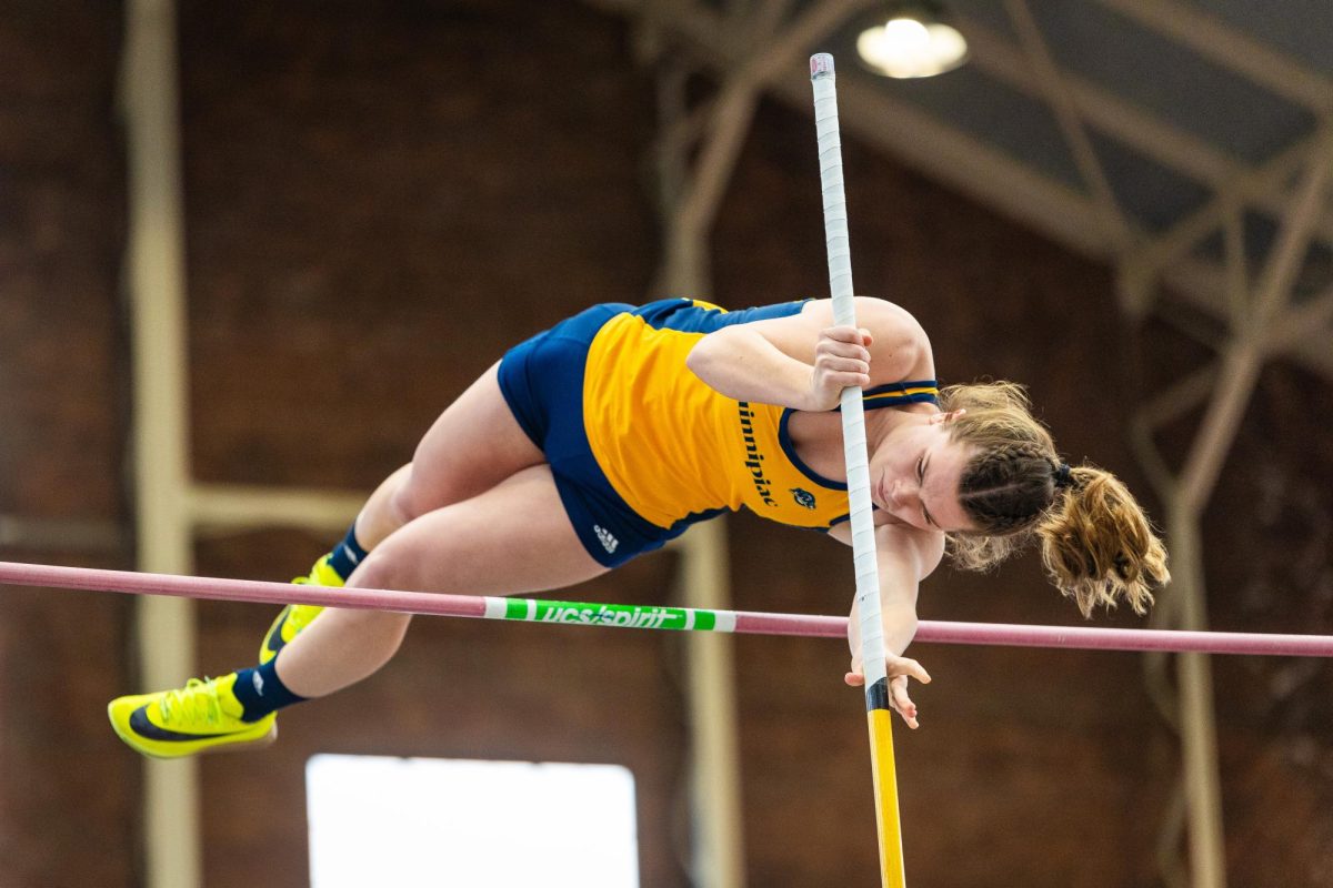 Sophomore pole vaulter Erin Brennan clears 3.50 meters and earns first in the pole vault.