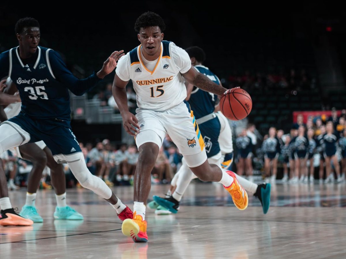 Sophomore forward Amarri Tice dribbles the ball against Saint Peter's in the MAAC semifinals in Atlantic City, New Jersey.