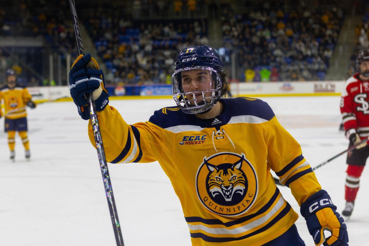 Senior forward Travis Treloar celebrates after scoring the third goal of the game against St. Lawrence on March 2, 2024, at the M&T Bank Arena.