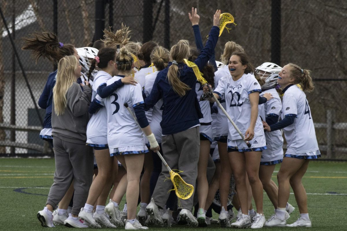 The Quinnipiac women's lacrosse team celebrate their 18-13 victory against Rider at Quinnipiac Lacrosse Stadium on Saturday, April 6, 2024. 