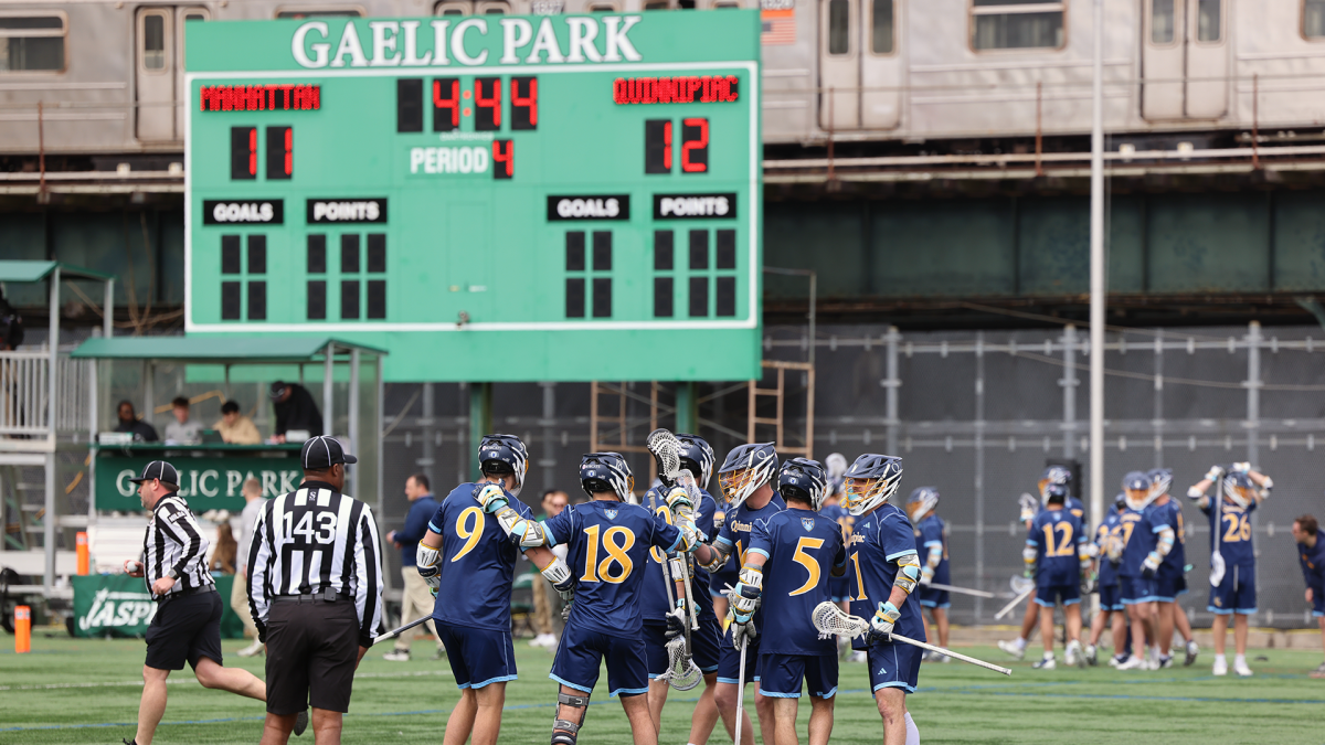 Quinnipiac men's lacrosse huddles before the next possession during the opening round of the MAAC playoffs against Manhattan.