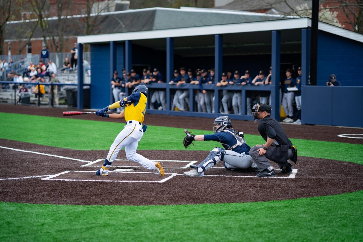 Sophomore outfielder Gabe Wright swings at an incoming pitch in a game against Canisius on April 20.