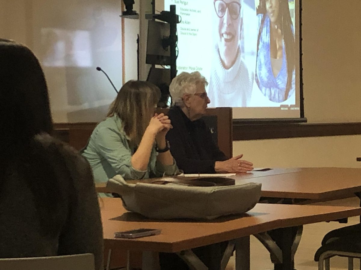 Sue Perlgut (right), the director of the movie "Connie Cook: A Documentary," and Maya Doyle, associate professor of social work and medical sciences, answer questions after the screening of the movie on March 28.