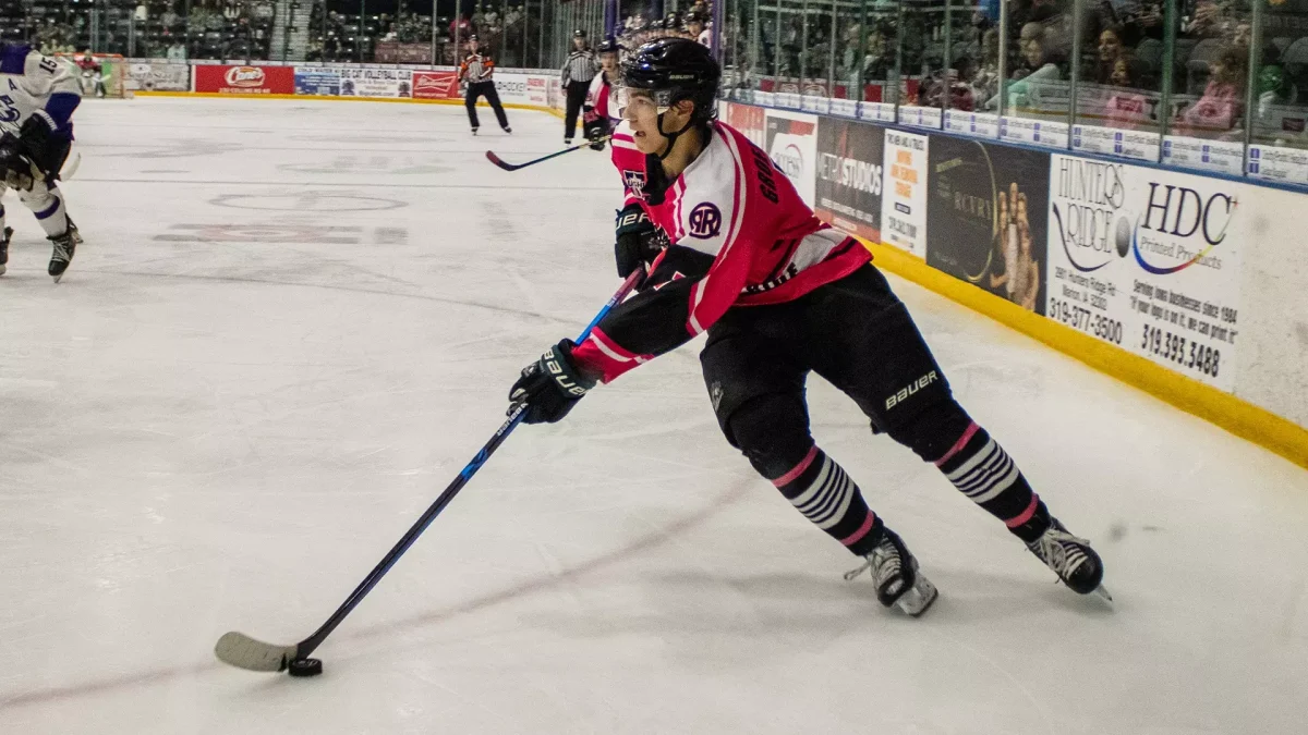 Elliott Groenewold handles the puck in a game for the Cedar Rapids RoughRiders.