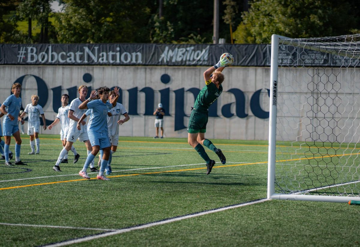 Quinnipiac junior goalkeeper Karl Netzell saves a shot in a game against Columbia on Aug. 30.