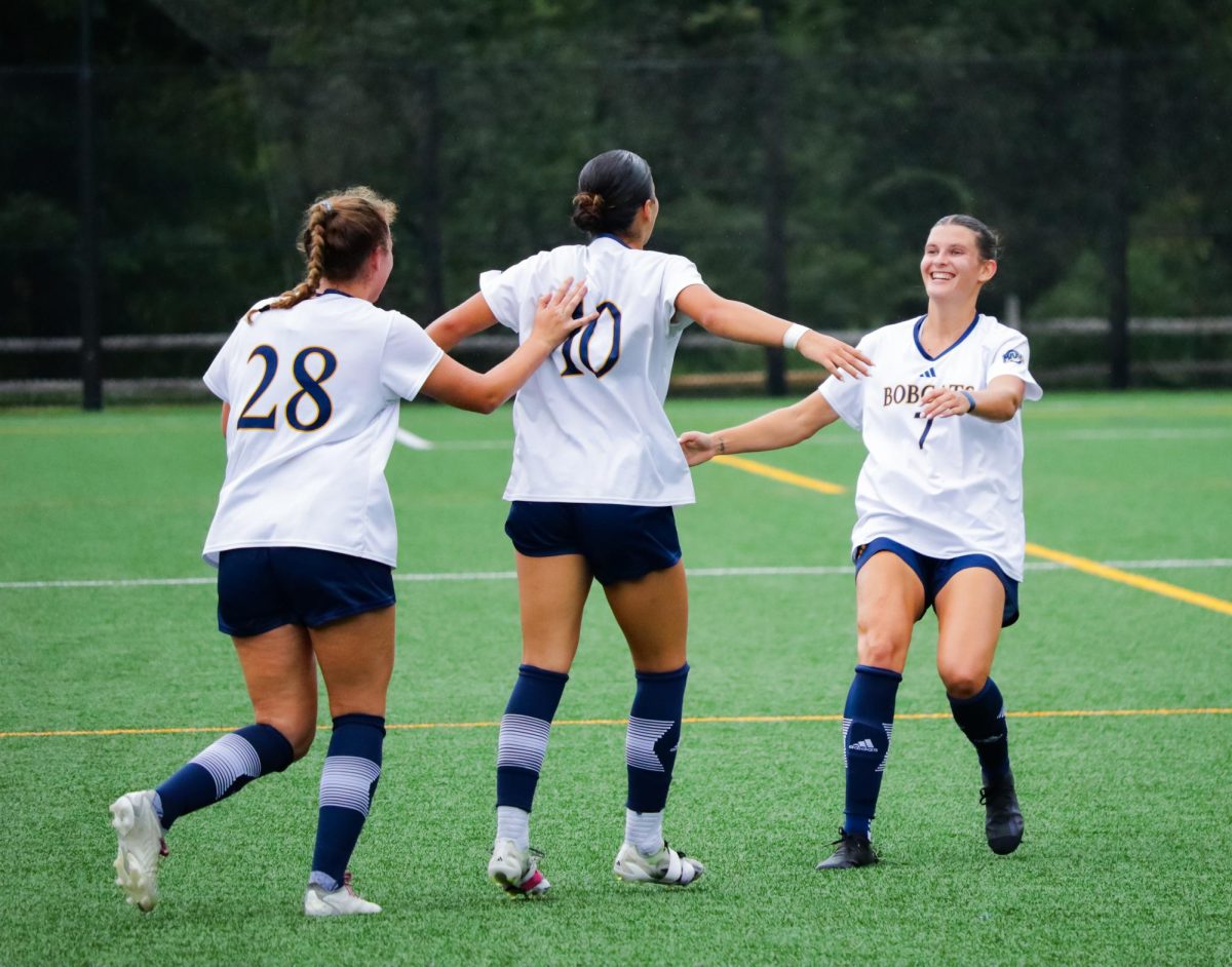 Quinnipiac women's soccer celebrates after a goal in a game against Albany on Sept. 1.