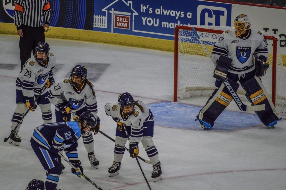 Quinnipiac prepares for the faceoff in a game against Maine on Sept. 29, 2023.