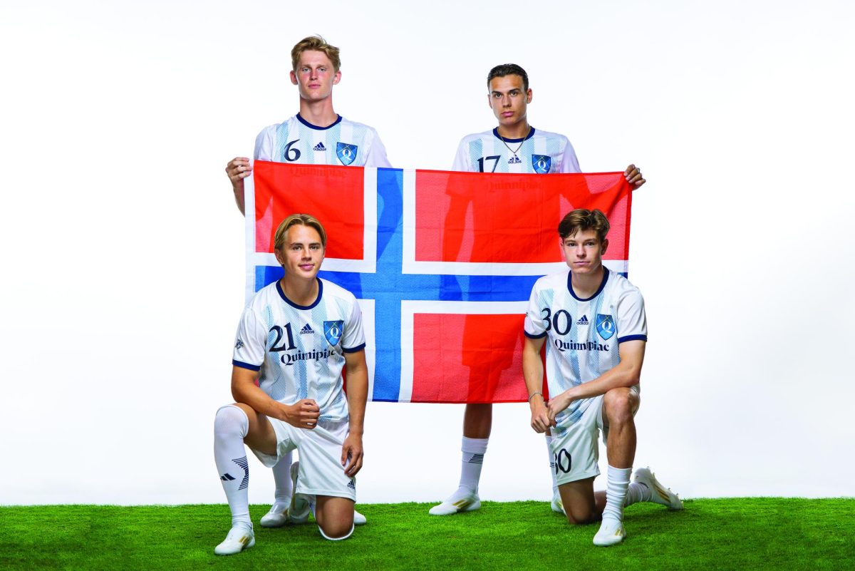 Freshman midfielders Sivert Ryssdalsnes (top left), Fredrik Moen (bottom right), junior forward Simon Bakken (bottom left) and freshman forward William Holum (top right) pose with the Norwegian flag.