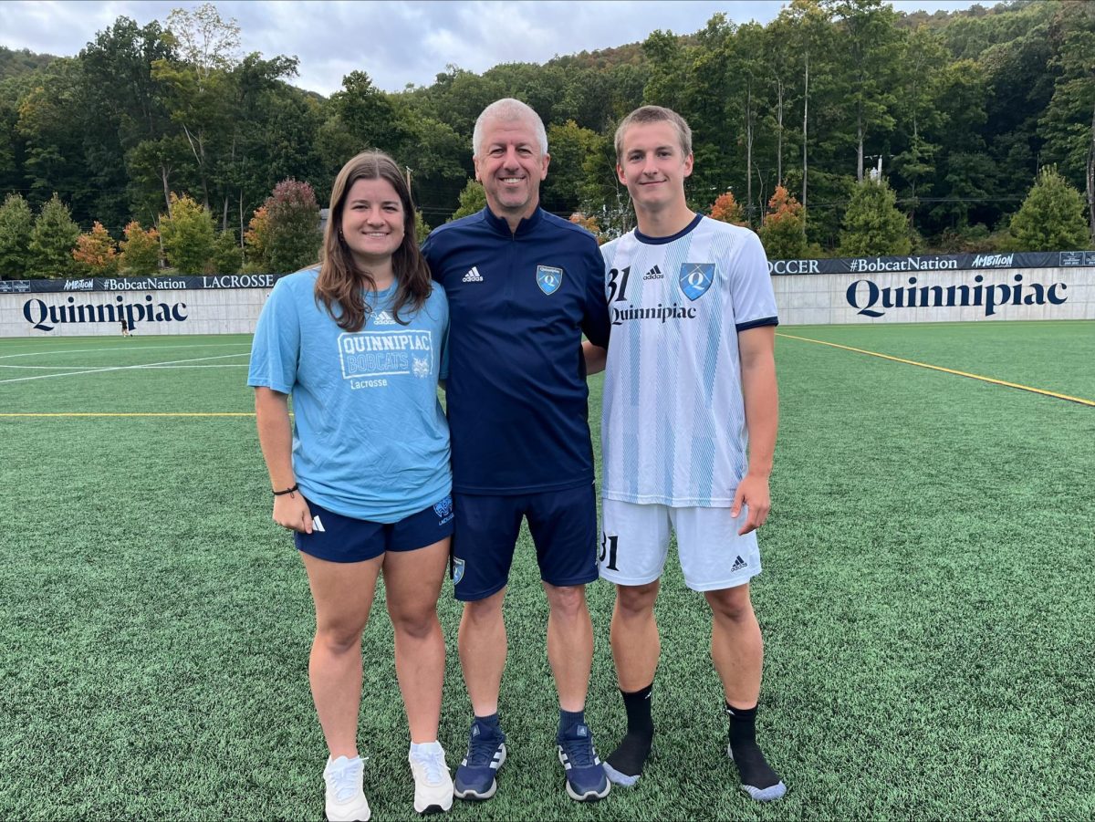 Bridget (left), Dave (middle) and Kevin Clarke (right) together after a men's soccer game on Sept. 24.