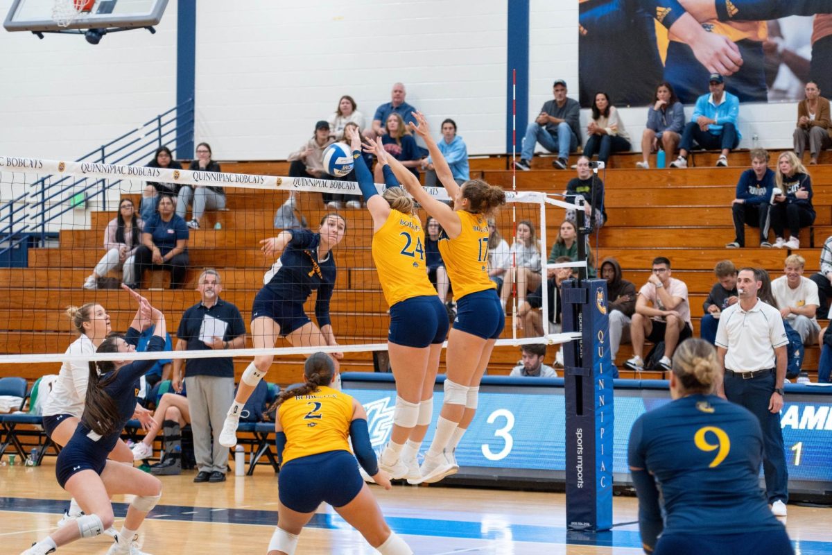 Junior middle blocker Bailey Brashear and graduate opposite Elena Giacomini versus Merrimack on October 2nd, 2024.