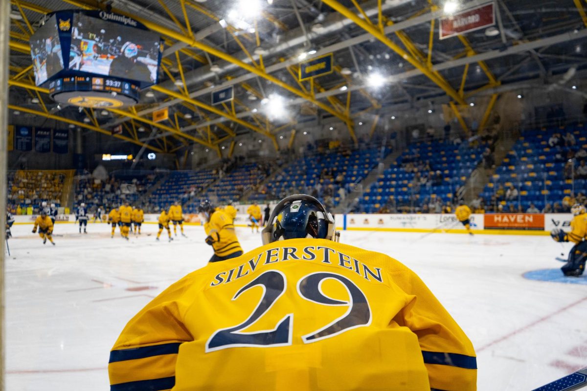 Freshman goaltender Dylan Silverstein warms up for a game against Penn State on Oct. 12, 2024 