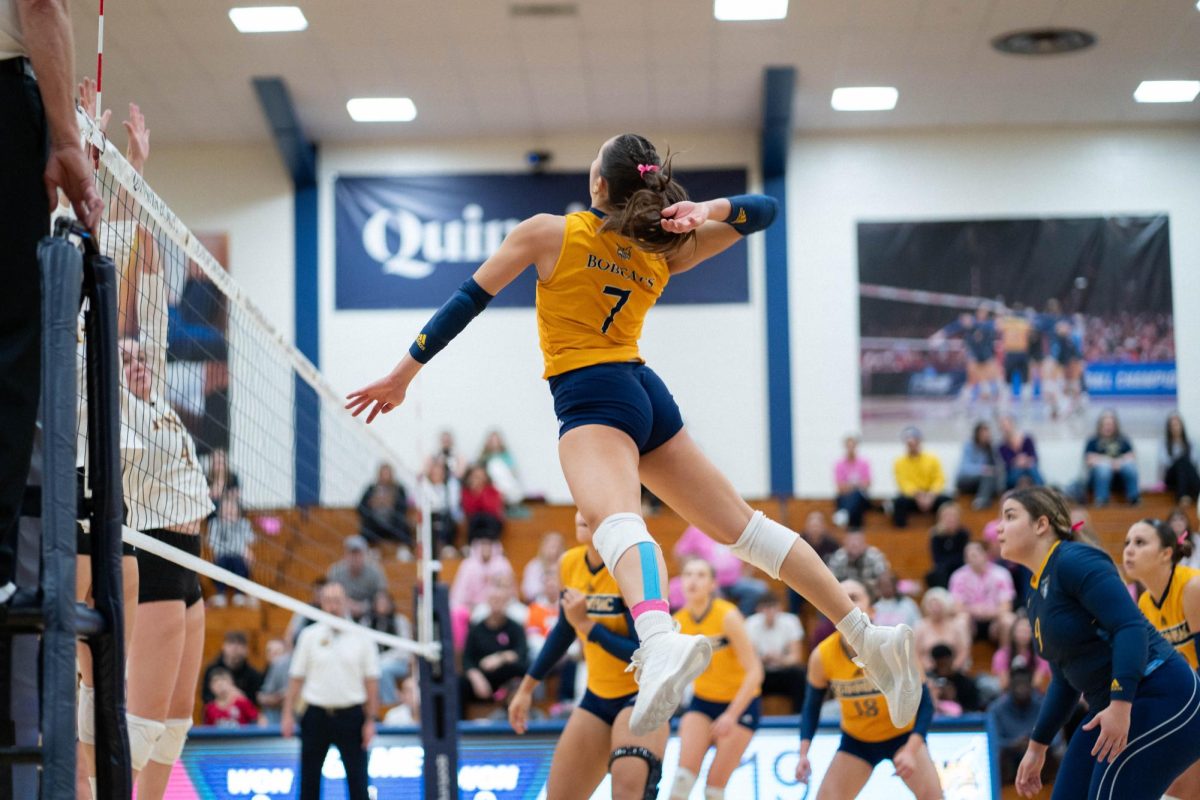 Junior outside hitter Yagmur Gunes goes in for a kill against Iona on Oct. 13.