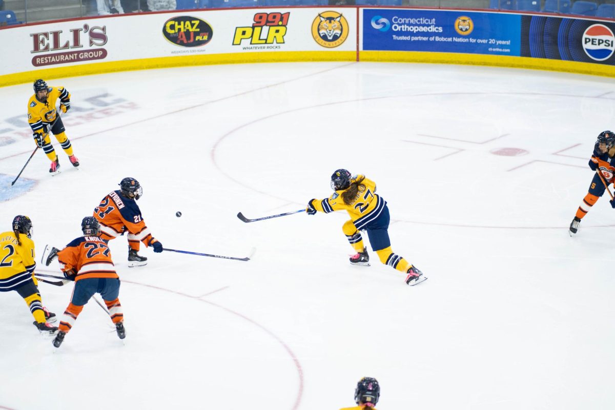 Senior forward Maya Labad shoots the puck in against Syracuse on Oct. 19.