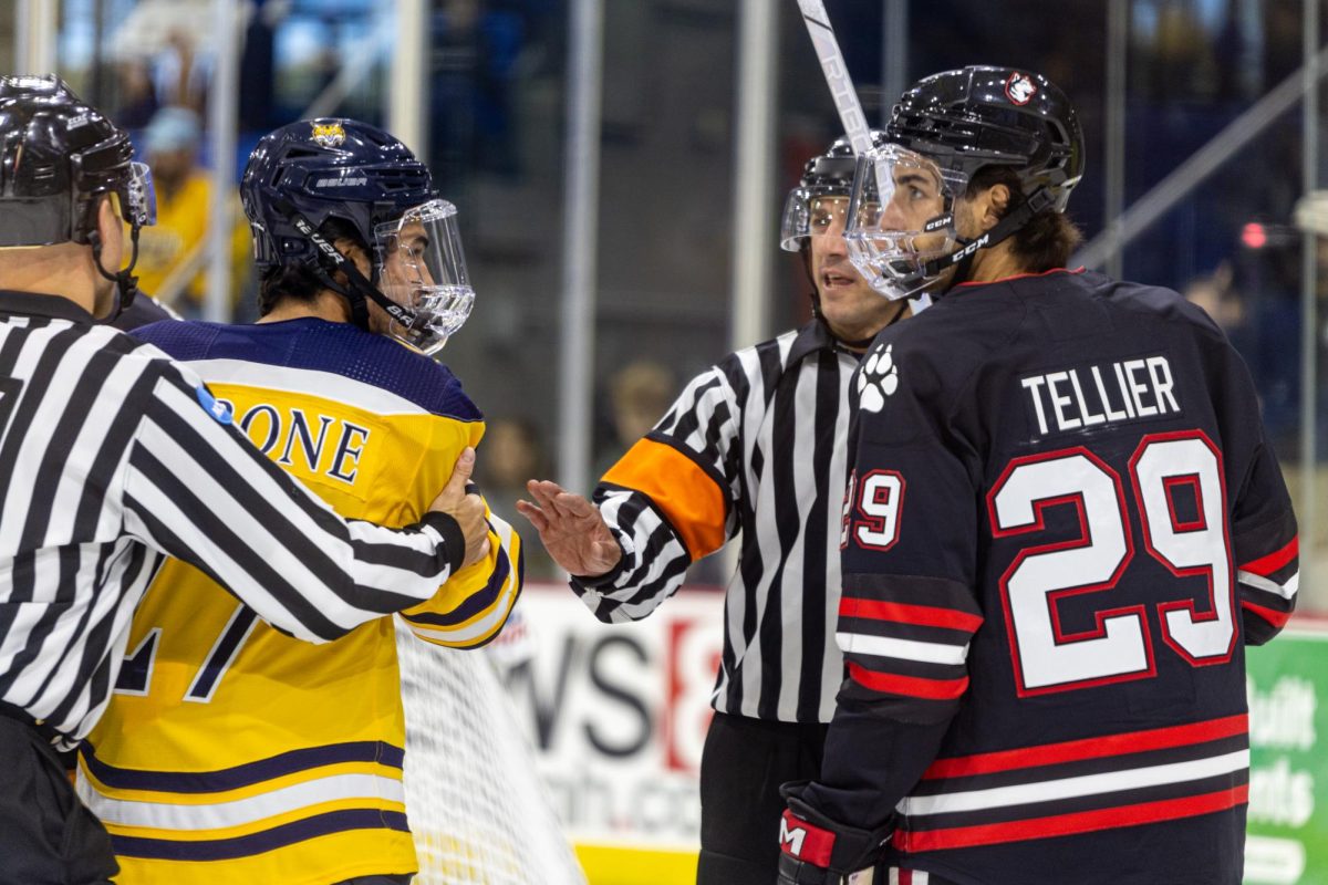 Quinnipiac sophomore forward Andon Cerbone looks at former teammate, senior forward Cristophe Tellier in an exhibition game on Oct. 6.