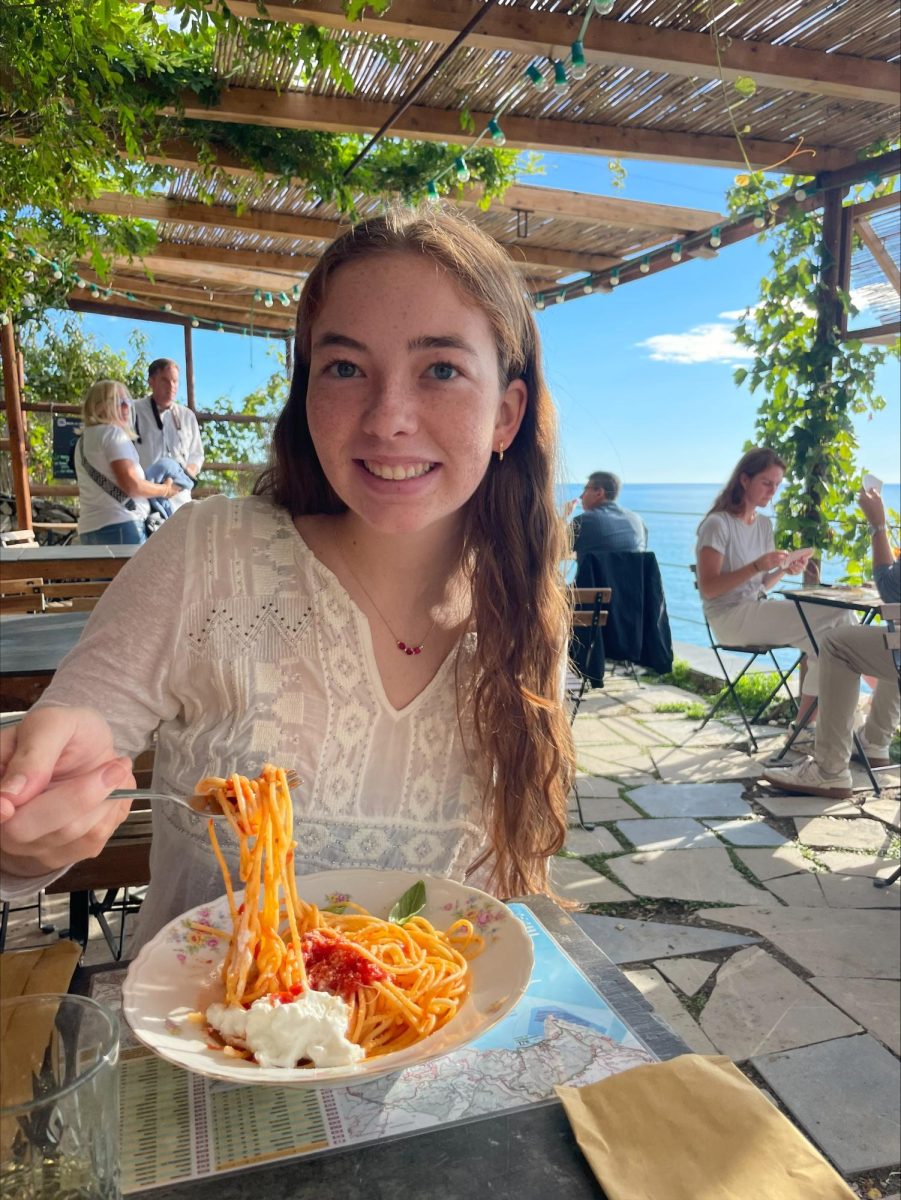 Conneely-Nolan eating spaghetti at a restaurant in Corniglia.