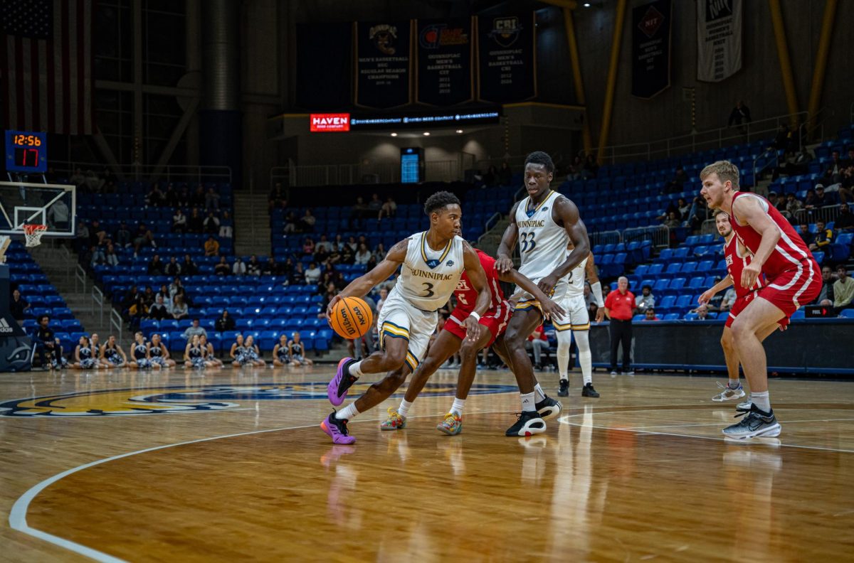 Graduate student guard Savion Lewis drives past a defender in a 71-47 win against WPI on Nov. 7.