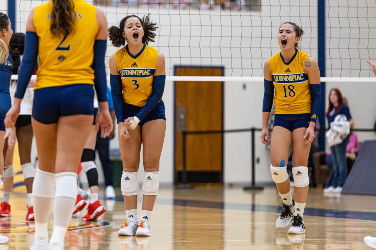 Senior opposite Alexandra Tennon and junior setter Damla Gunes celebrate in a match against Fairfield on Nov. 3.