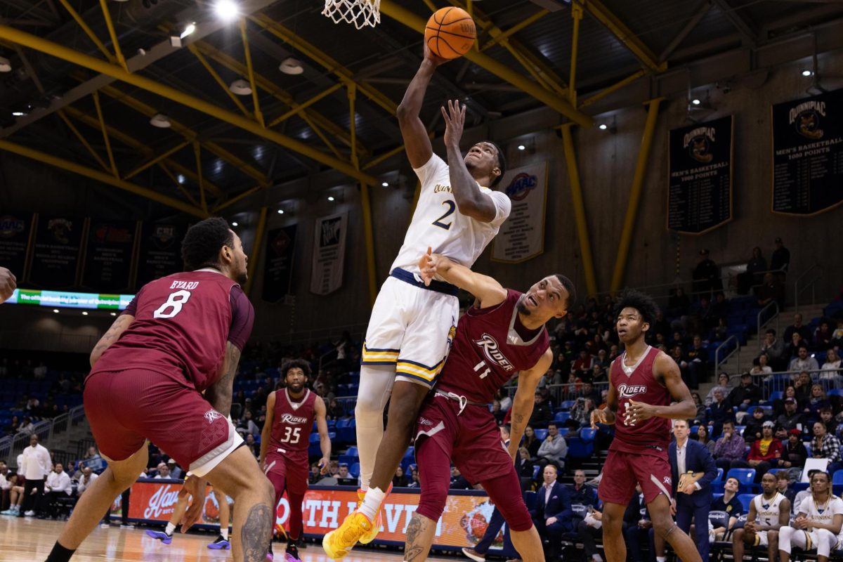 Sophomore guard Khaden Bennett is fouled during a lay-up against Rider on Saturday, Jan. 25