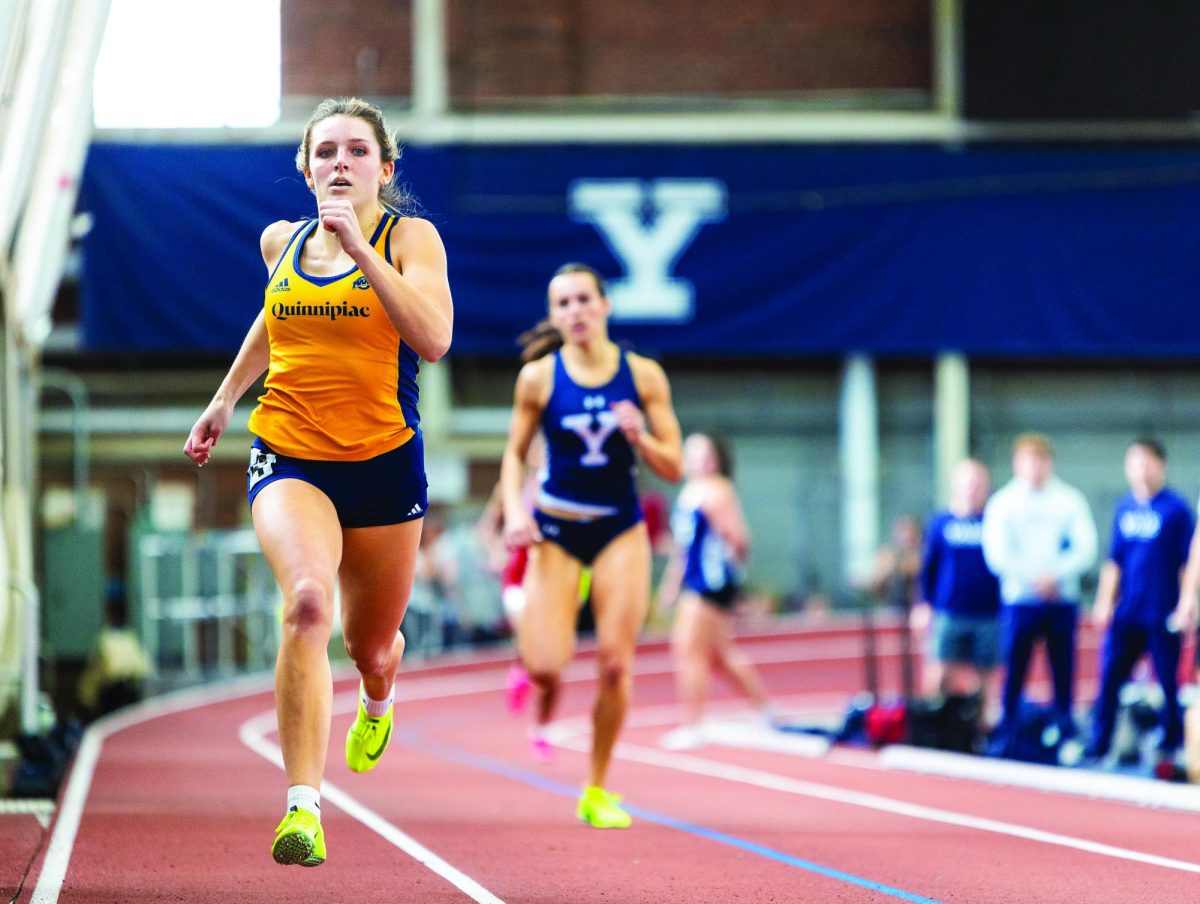 Senior sprinter Rylie Smith runs at the Yale Season Opener on Dec. 9, 2023.