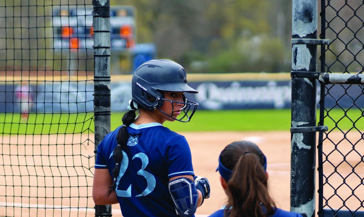 Junior outfielder Ally Hochstadter waits on deck against Sacred Heart on April 17, 2024.