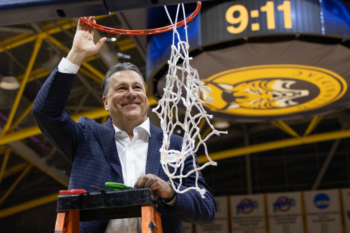 Head coach Tom Pecora smiles after clinching the MAAC regular season conference title after defeating Mount St. Mary's 79-70 on March 6.