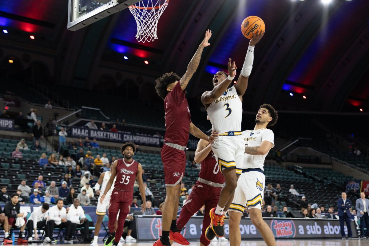 Graduate student guard Savion Lewis shoots a layup in a 78-64 win over Rider in the MAAC Quarterfinals on March 12.