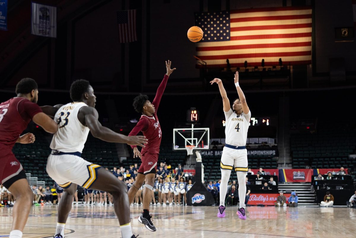 Sophomore guard Khaden Bennett shoots a three-pointer in a 78-64 win over Rider in the MAAC Quarterfinals on March 12.