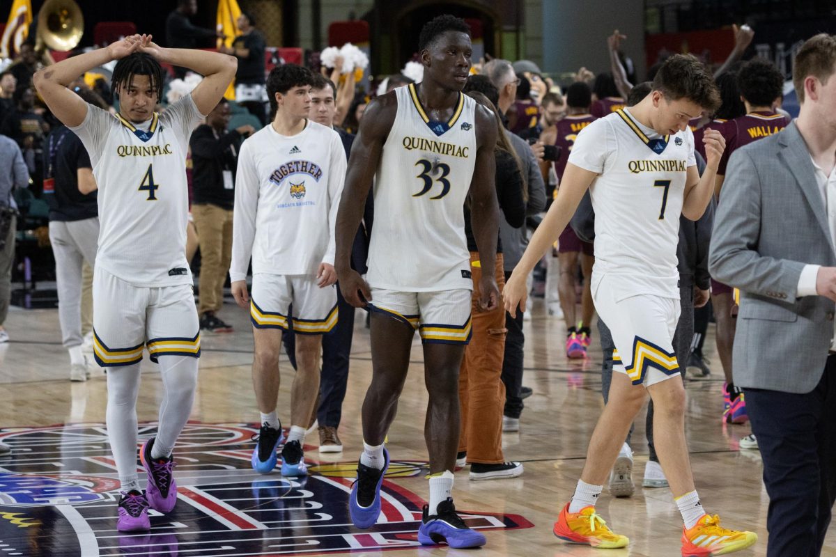 (From left) Sophomore guard Khaden Bennett, freshman guard Samson Reilly, graduate student forward Paul Otieno and junior guard Ryan Mabrey walk off the court after a 81-73 loss to Iona in the MAAC Semifinals on March 14.