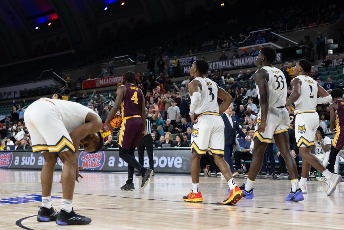 (From left) Quinnipiac Senior guard Doug Young, graduate student guard Savion Lewis, graduate student forward Paul Otieno and junior forward Amarri Monroe stands stunned in a 81-73 loss to Iona in the MAAC Semifinals on March 14.