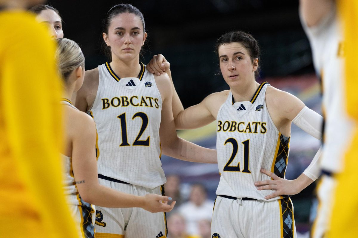 Junior forward Ella O'Donnell (left) and senior guard Jackie Grisdale (right) stand together in a 65-51 win over Merrimack in the MAAC Semifinals on March 14.