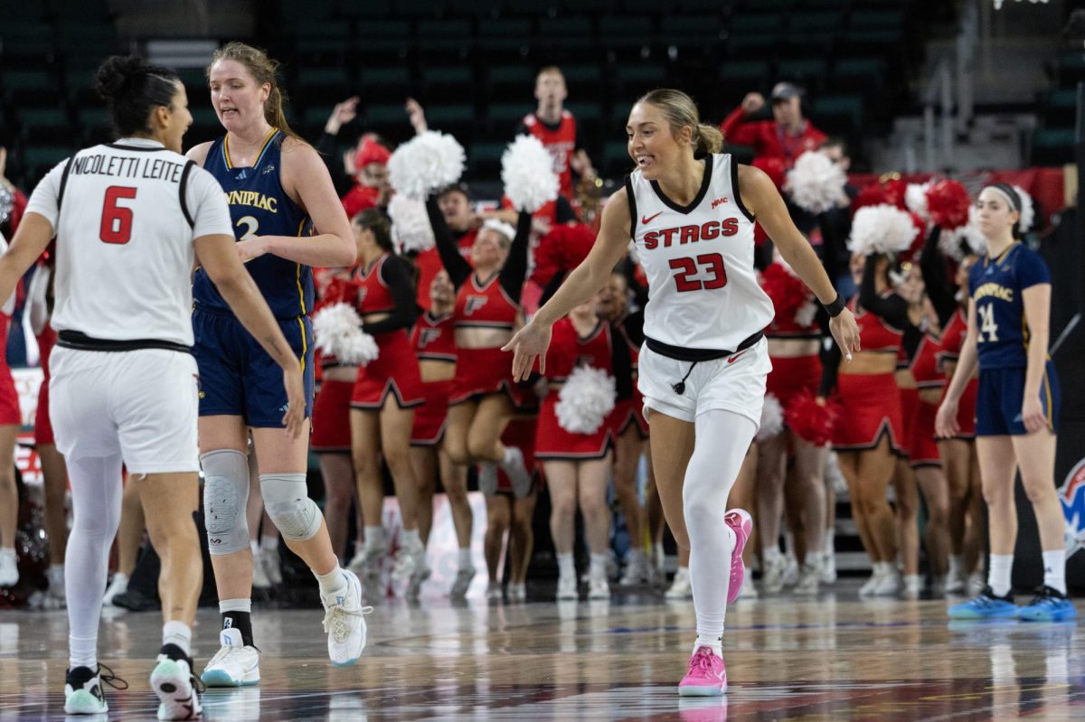 Sophomore center Anna Foley (left) and freshman guard Gal Raviv watches Fairfield celebrate in a 76-53 loss on March 15.