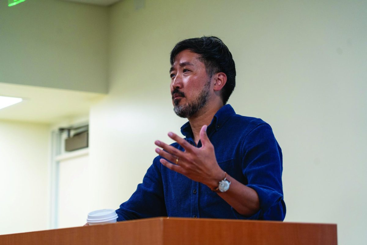 English professor and Director of Creative Writing Jason Koo speaks at his book reading and discussion on Sept. 26, 2024. 
